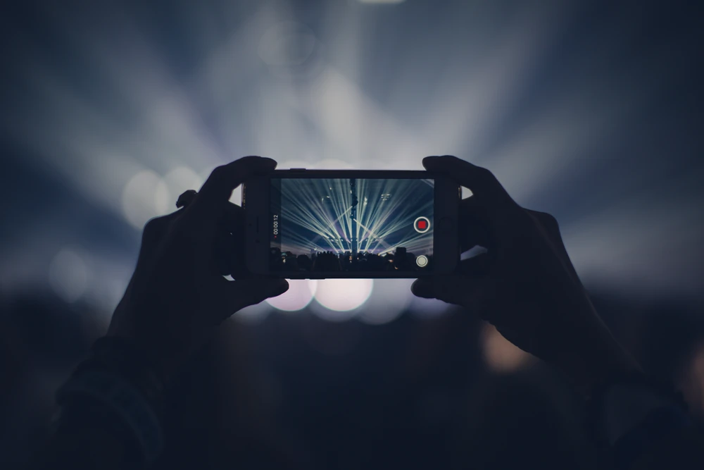 filming a concert on phone