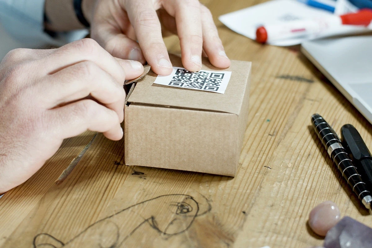 A person using a QR code to reduce packaging materials